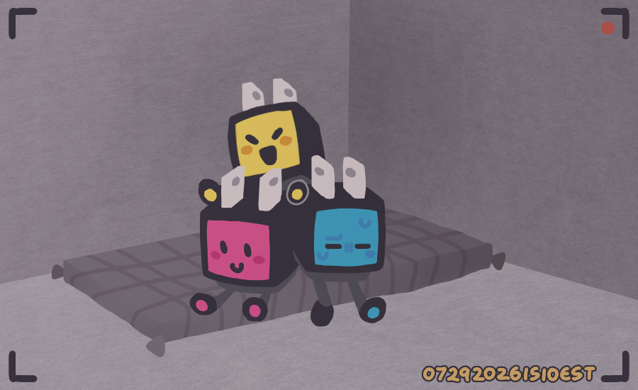 Three adaptor-shaped robots, blue, yellow, and red, sitting on a gray cushion in the corner of a gray room.